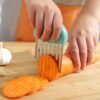 0bf8a0e5a65ea54285194379c2e1241f.jpg Stainless Steel Deep Wolf Tooth Potato Cutter with Wavy Slice Design